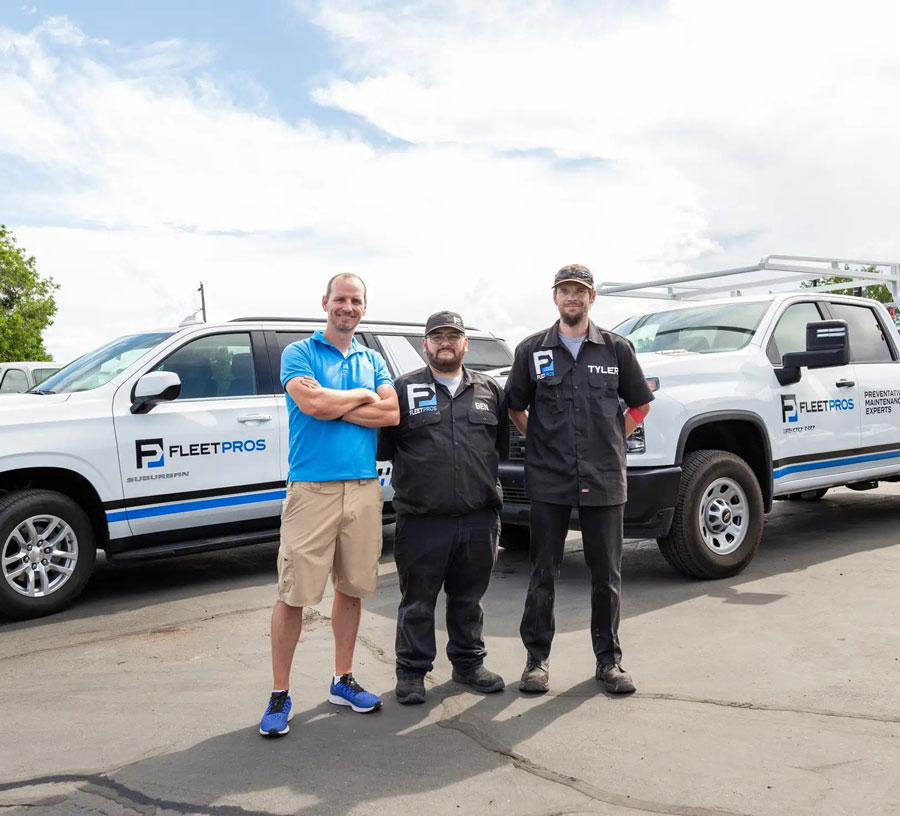 The Fleet Pros crew standing in front of their Trucks